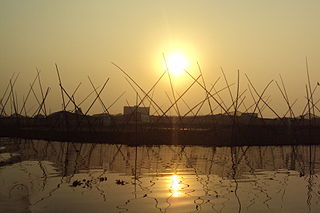 https://commons.wikimedia.org/wiki/File:Sunset_at_Atrai_River_(1).jpg