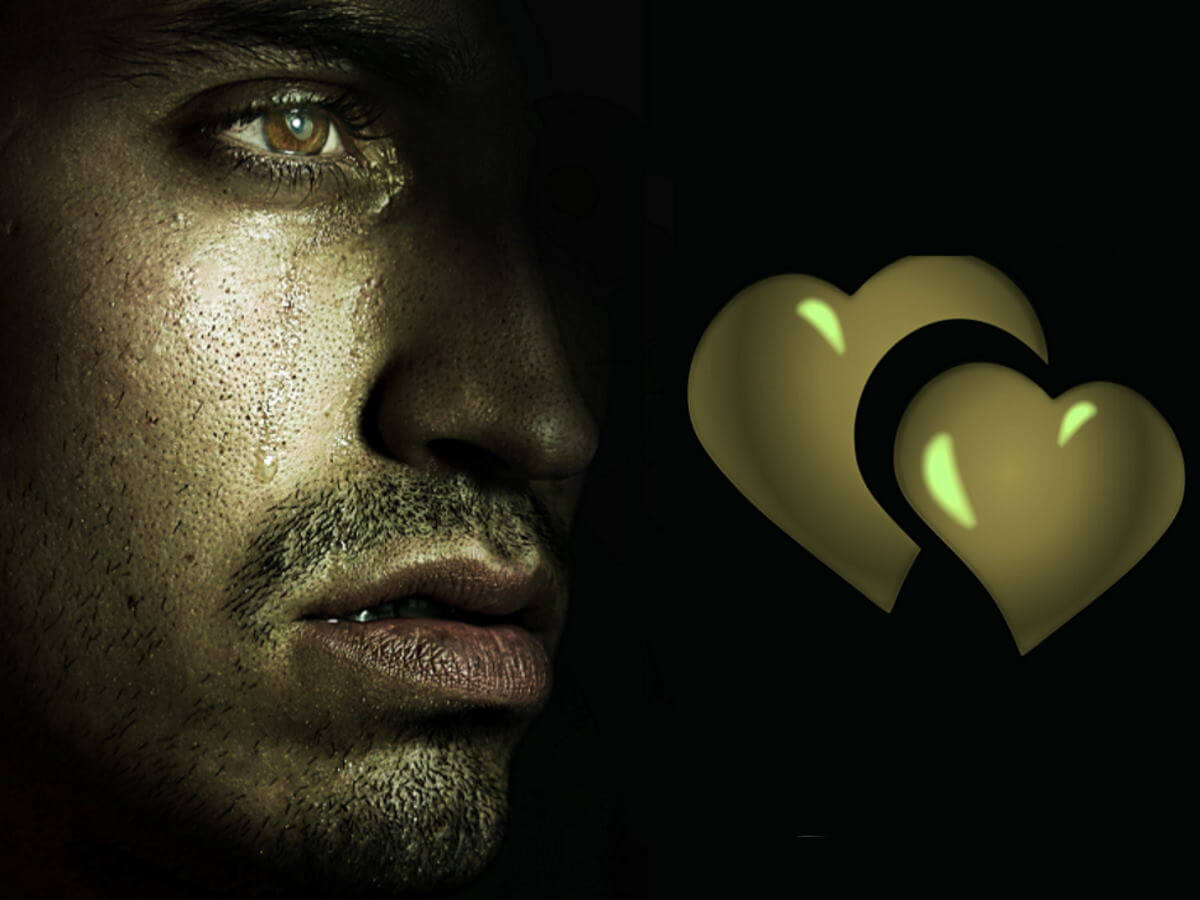 Une larme coule sur la joue d’un homme.