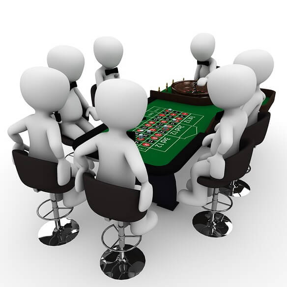 6 parieurs autour d’une table de roulette de casino