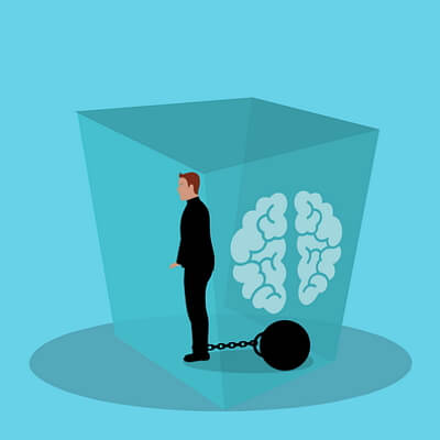 Dessin d’un cerveau emprisonné dans un cube.