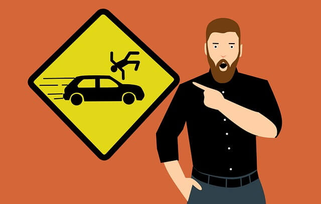 Panneau de prudence qui décrit un accident.