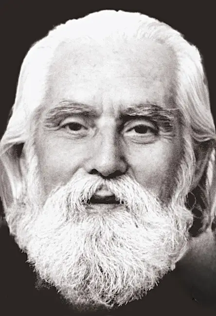 Photo en gros plan d'Aïvanhov âgé, la barbe et les cheveux blancs